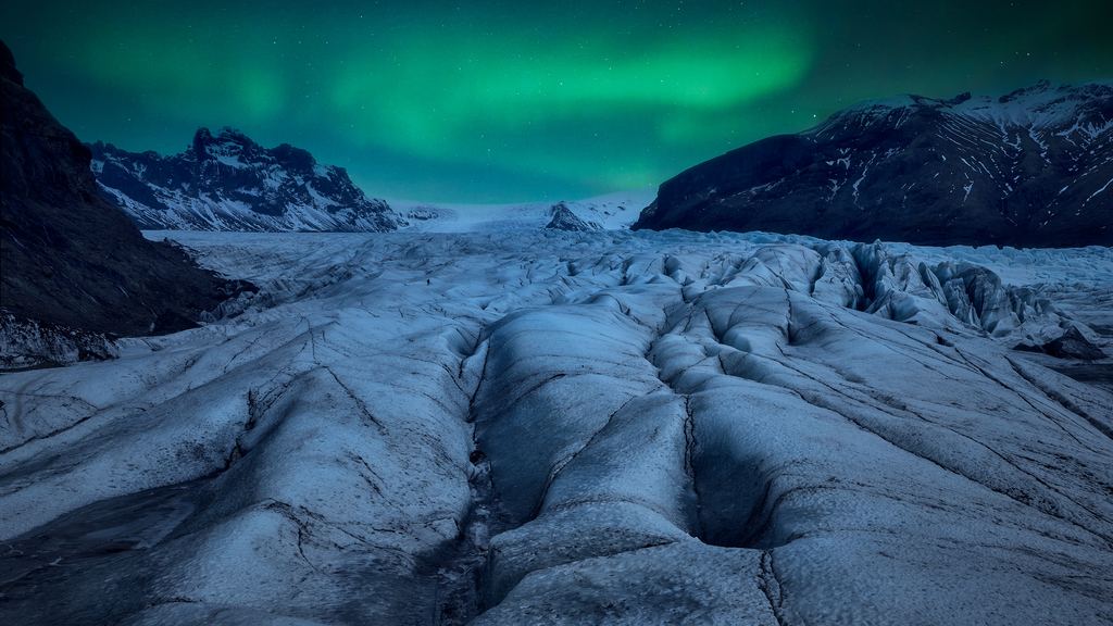 Aurora above a glacier at night in Iceland
