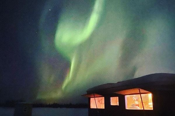 Aurora Ice: Ice Fishing and Salmon Dinner under the Northern Lights