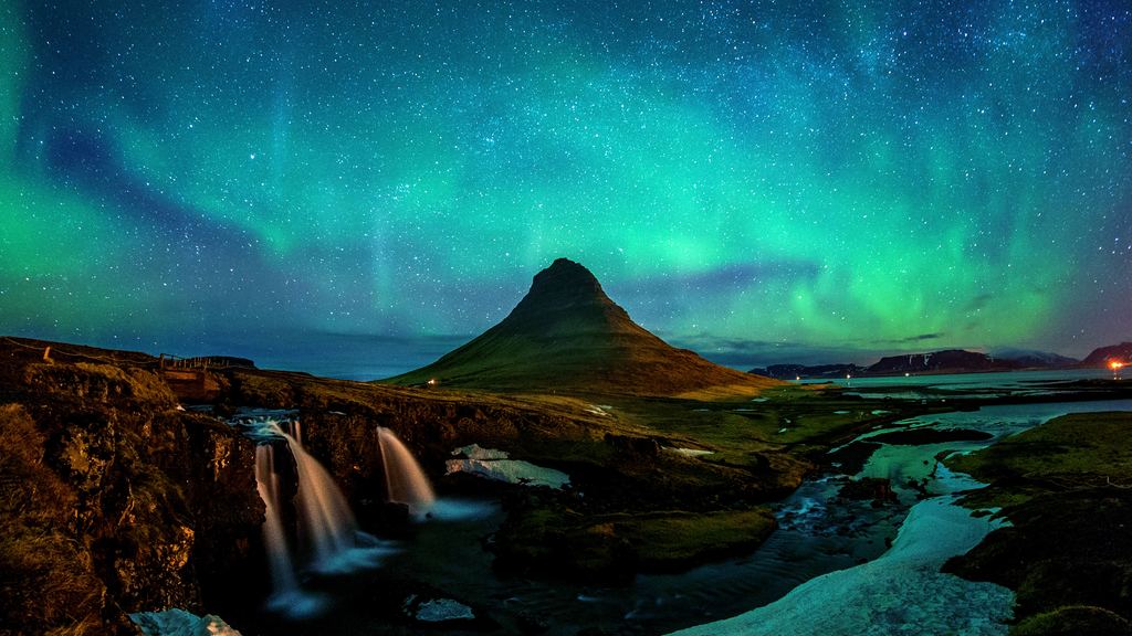 Aurora above Kirkjufell mountain in Iceland