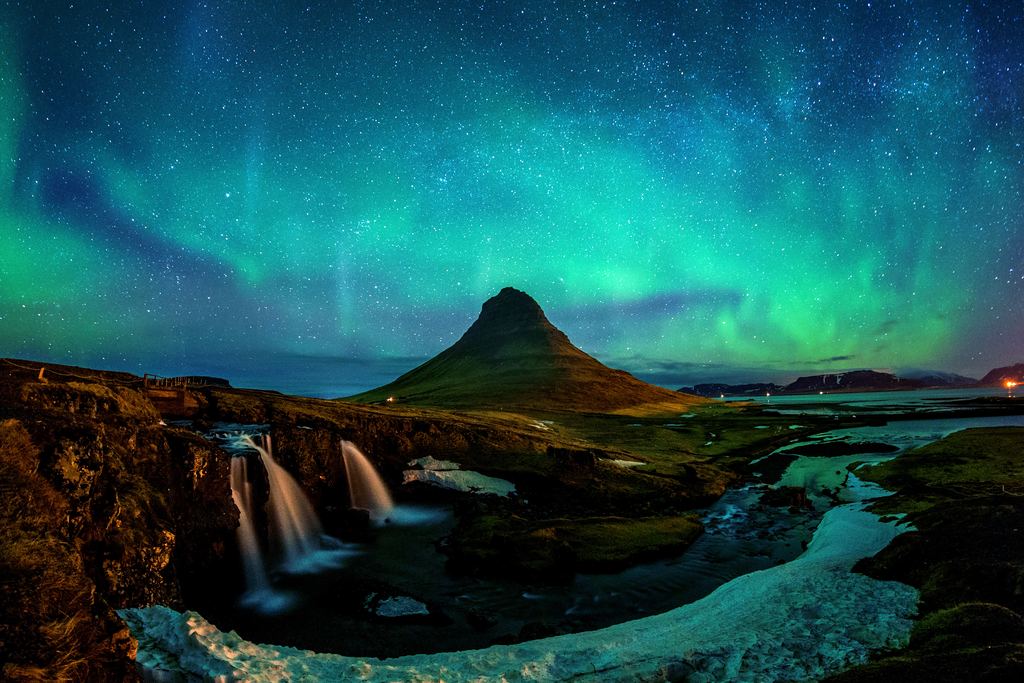 Aurora above the Kirkjufell mountain in Iceland on a clear winter night