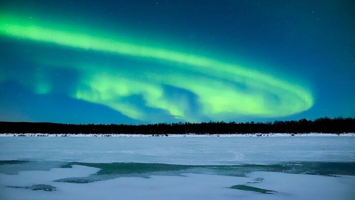 Aurora Evening on a Frozen Lakeside near Rovaniemi