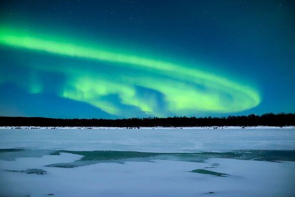 Aurora Evening on a Frozen Lakeside near Rovaniemi