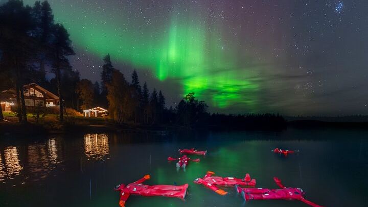 Ice Floating on a Frozen Forest Lake under the Aurora, Rovaniemi