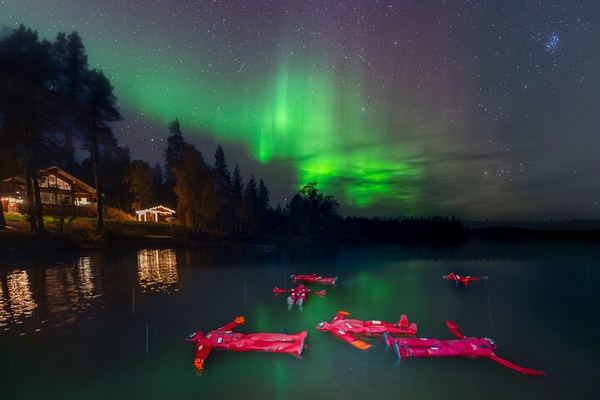 Ice Floating on a Frozen Forest Lake under the Aurora, Rovaniemi