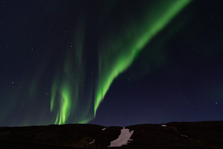 Chasse aux aurores en minibus au départ de Reykjavik, avec couvertures, chocolat chaud et photos gratuites (12/12)