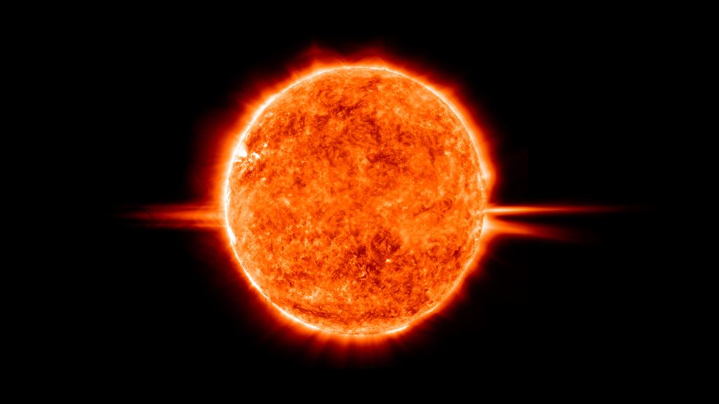 A prominence arcs off the edge of the sun against the solar disc