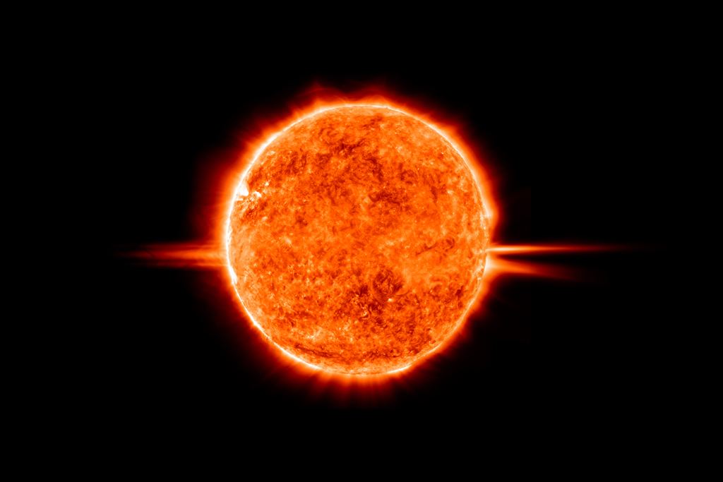 The sun's surface with a large prominence arcing off the limb